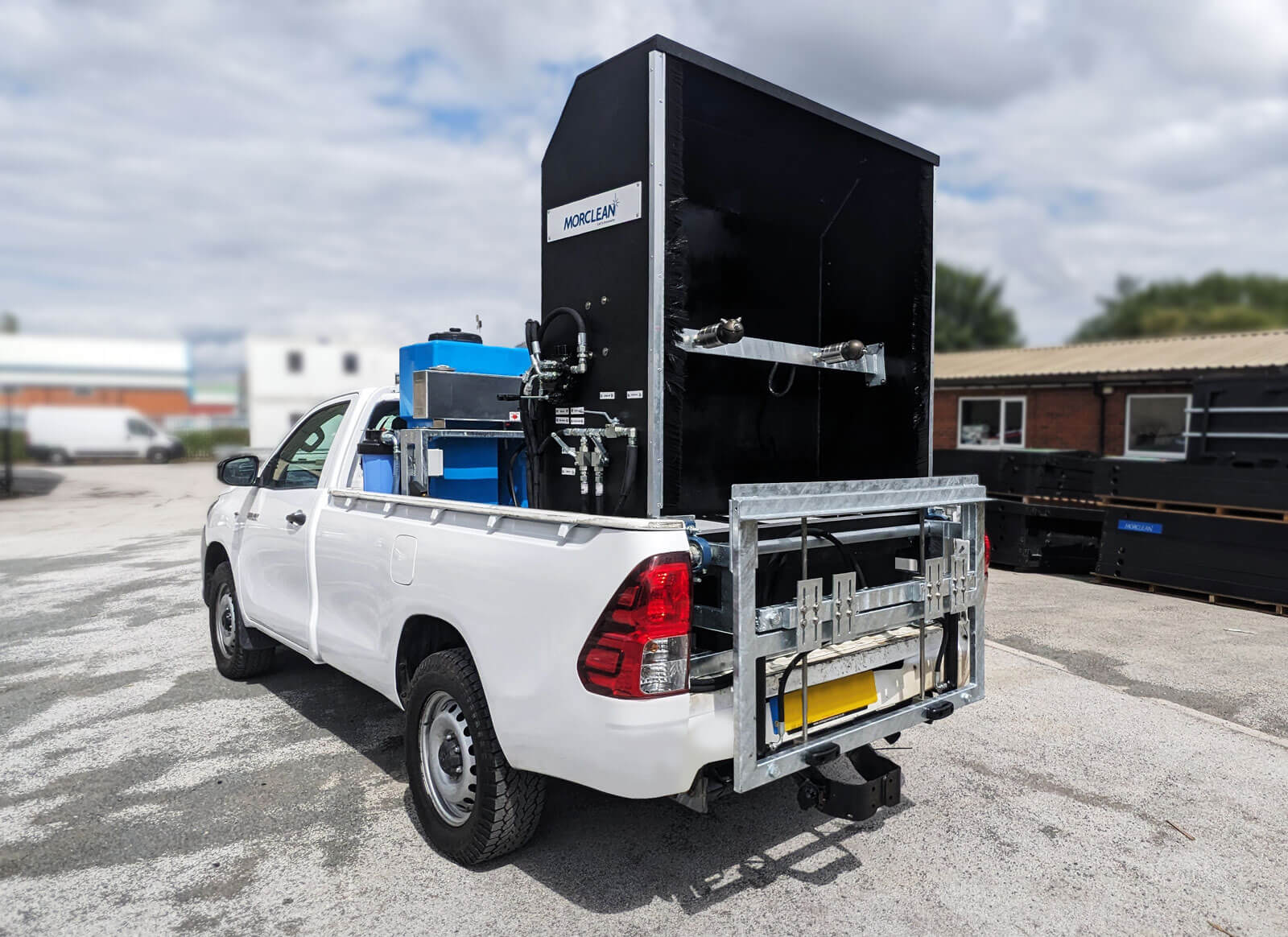 Rear show of the automatic bin wash mounted on a pick up truck.